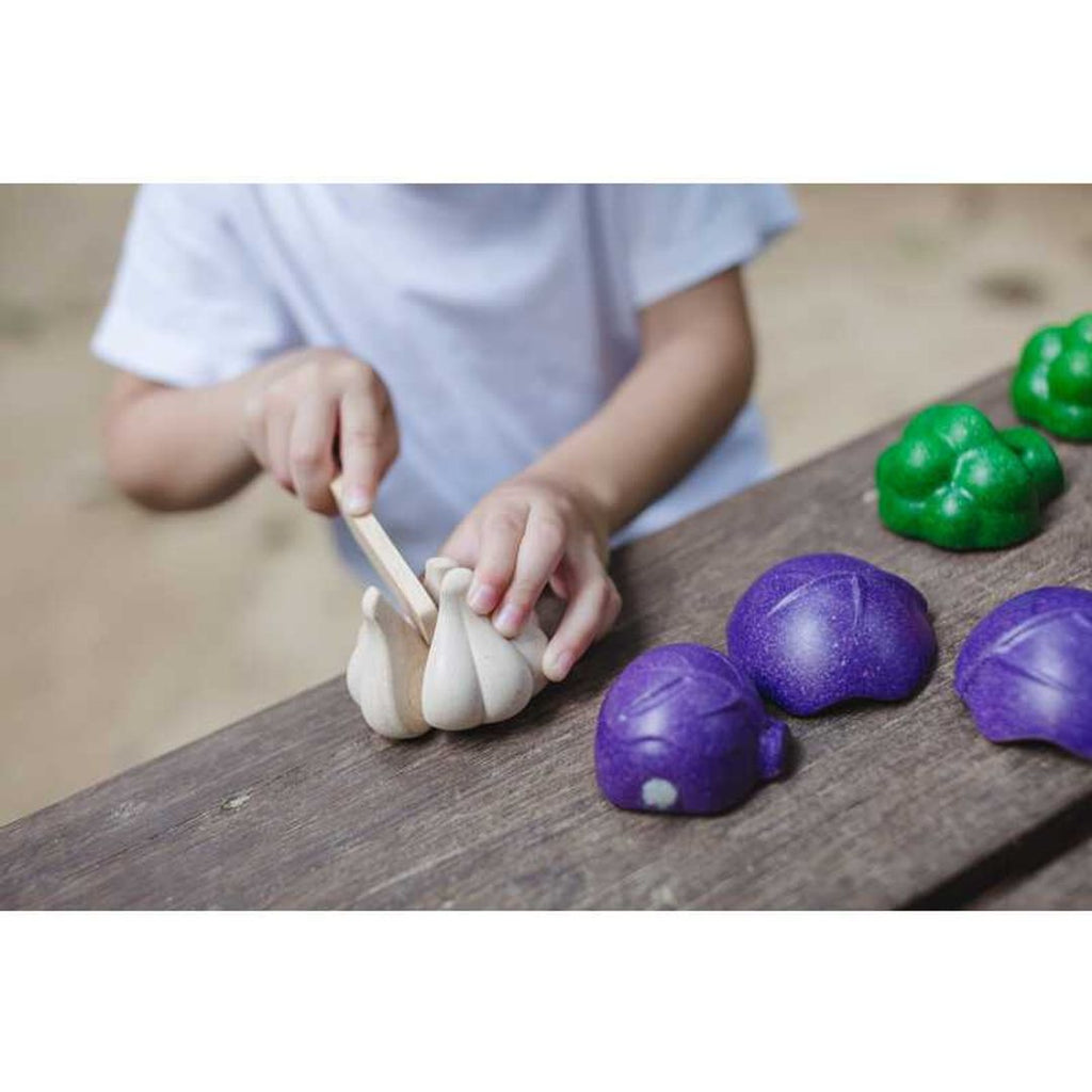 Kid playing PlanToys 5 Colors Veggie Set