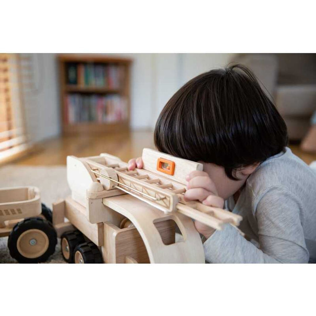 Kid playing PlanToys Tool Belt