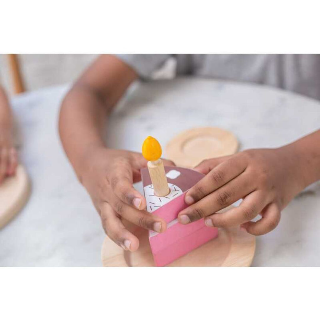 Kid playing PlanToys Birthday Cake Set