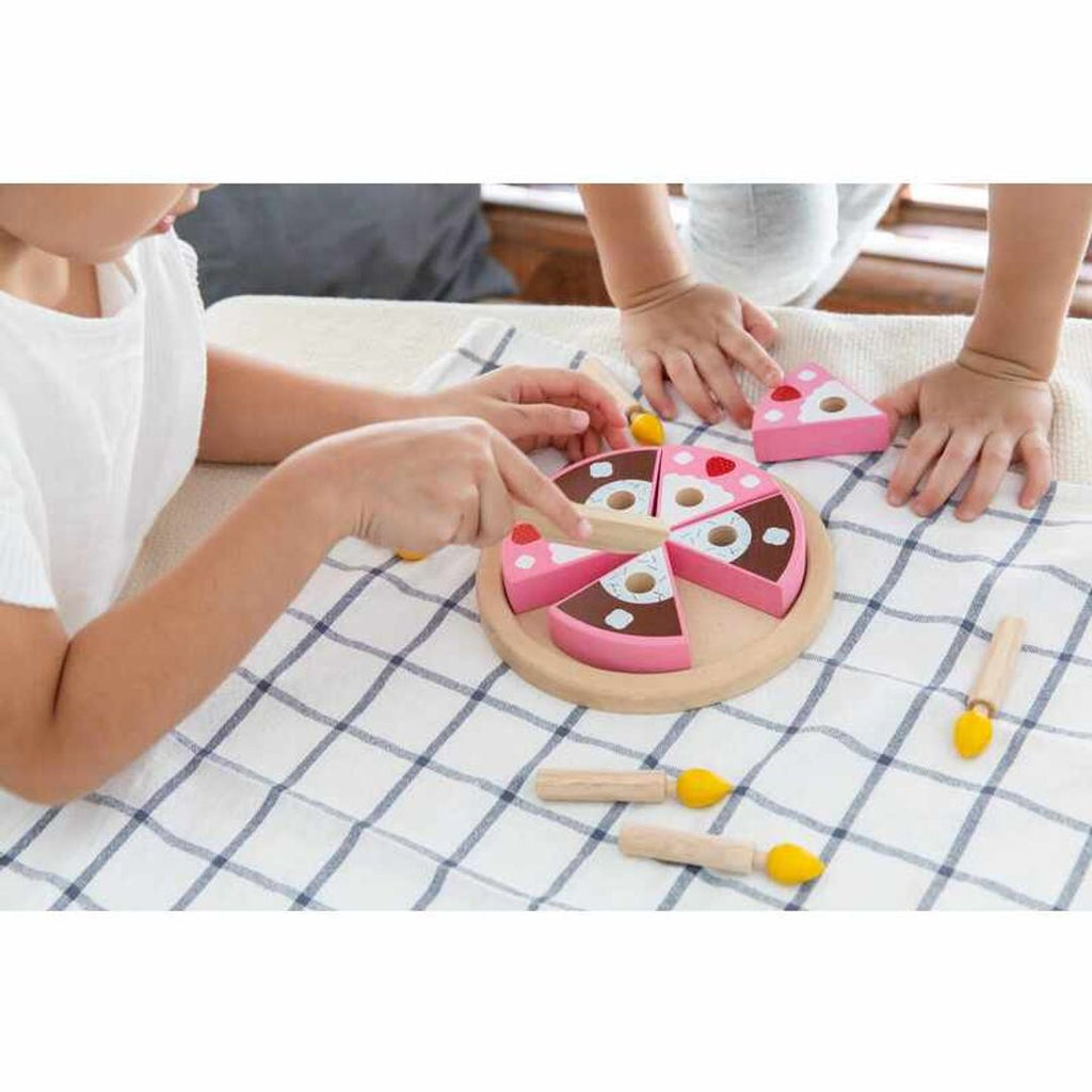 Kid playing PlanToys Birthday Cake Set