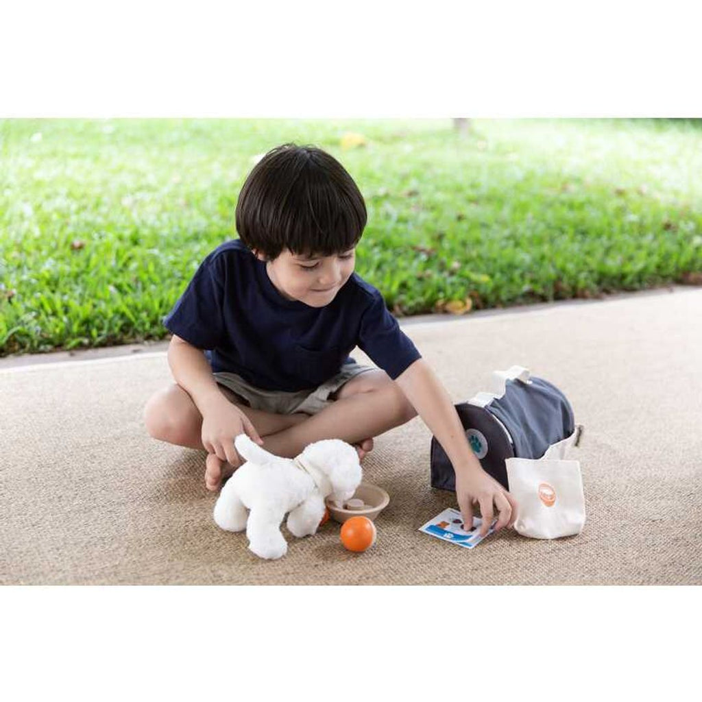 Kid playing PlanToys Pet Care Set