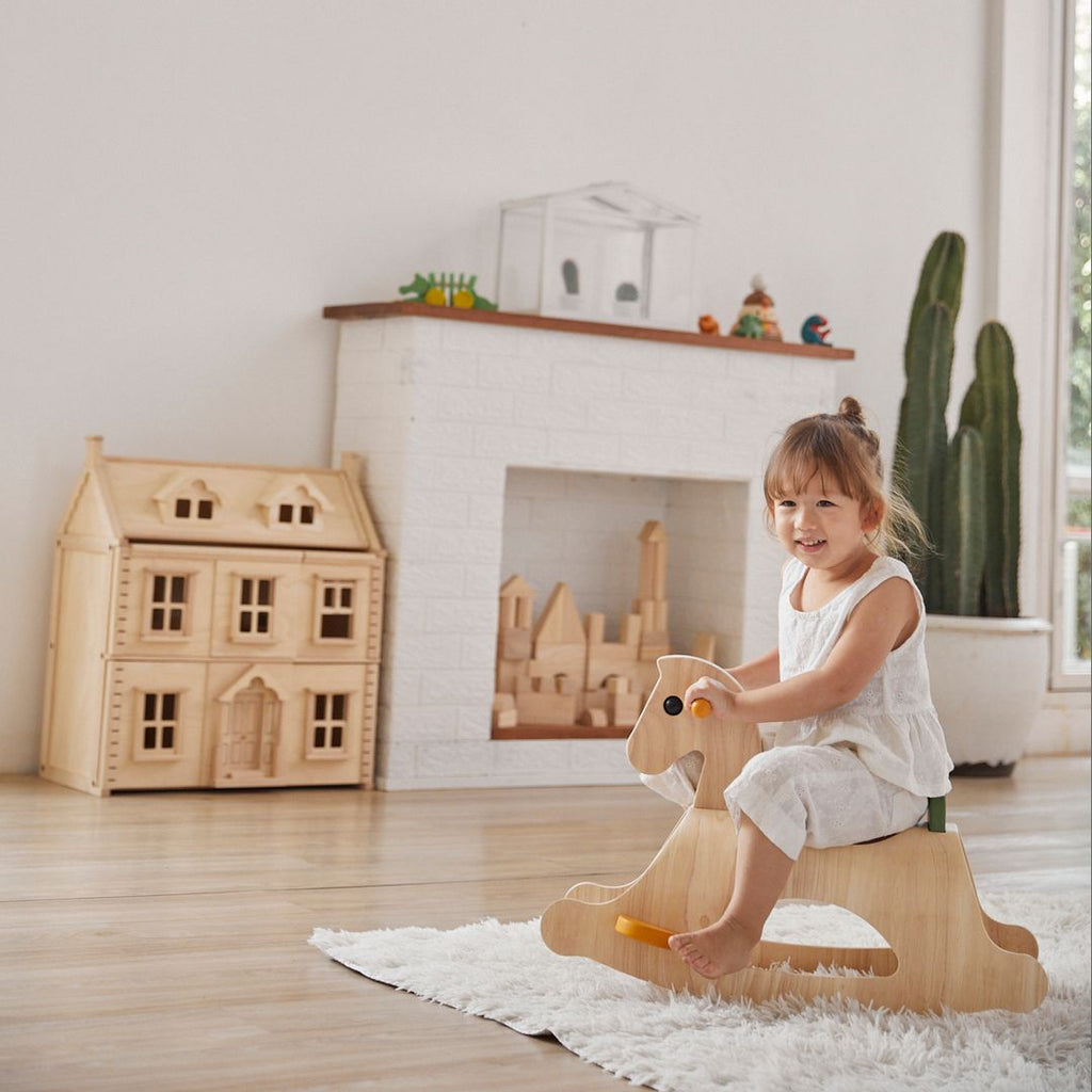 Kid playing PlanToys Palomino - Modern Rustic