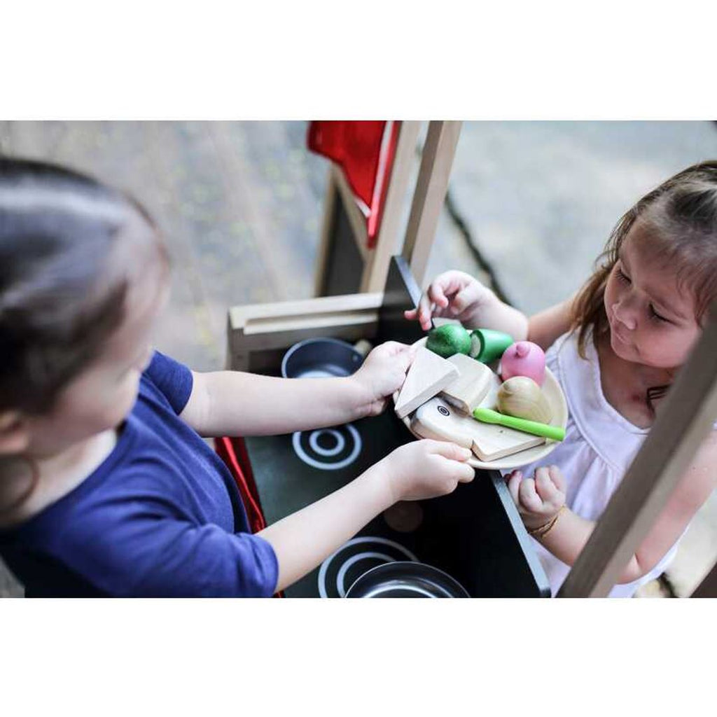 Kid playing PlanToys Play Center