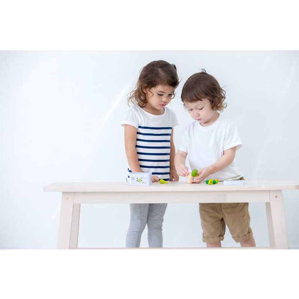 Kid playing PlanToys Balancing Cactus