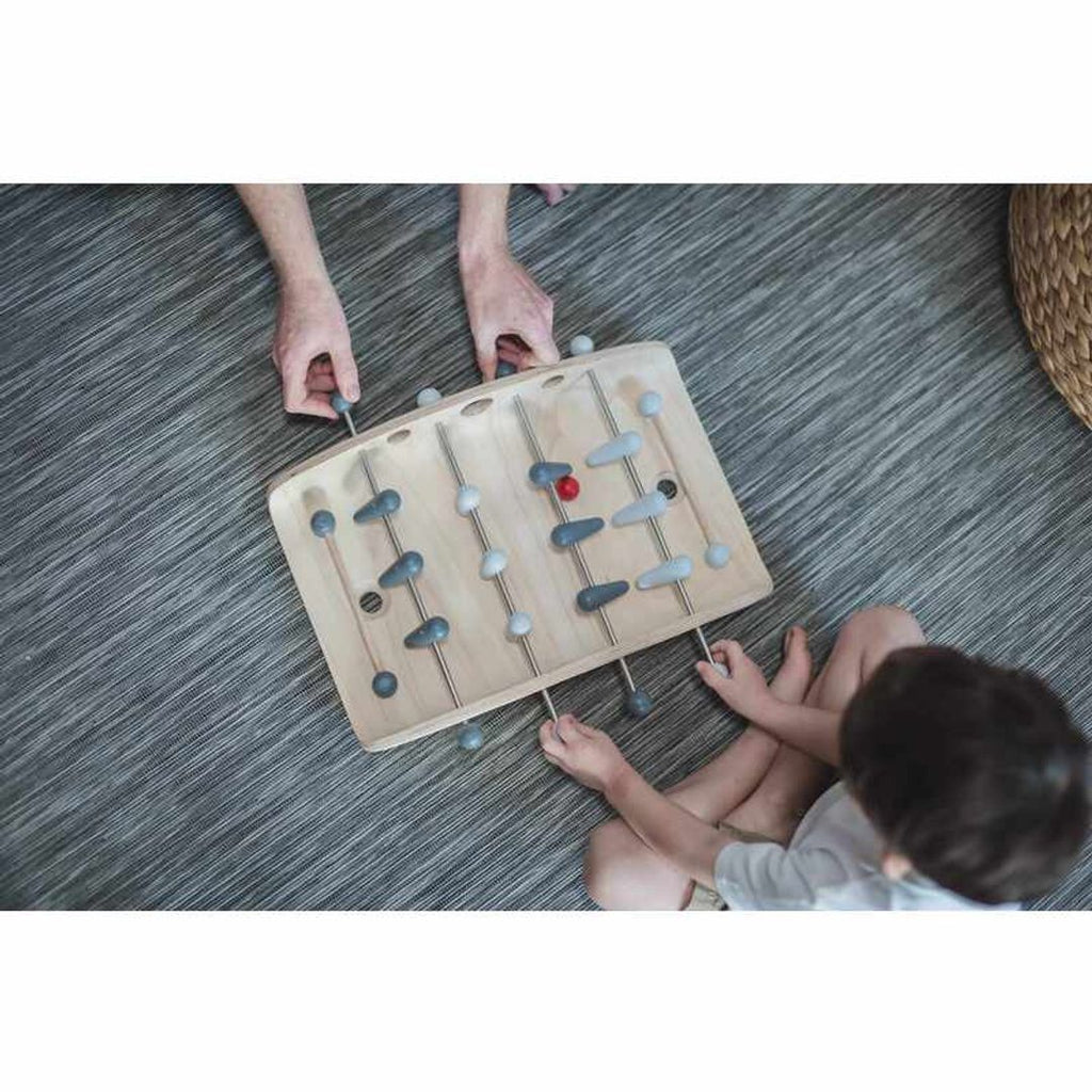 Kid playing PlanToys Soccer