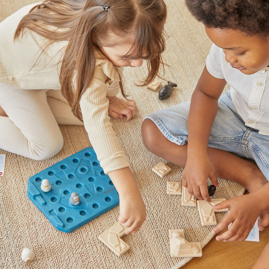 Kid playing PlanToys Finding Penguin Game