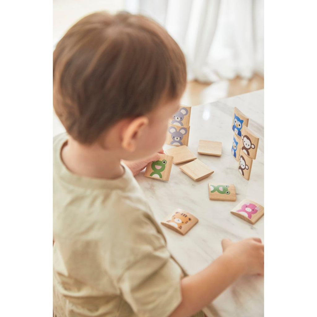 Kid playing PlanToys Animal Memo