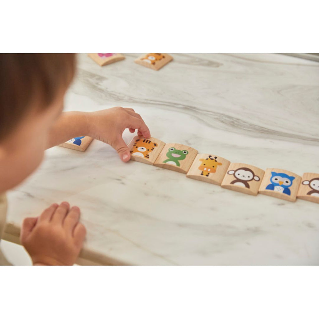 Kid playing PlanToys Animal Memo