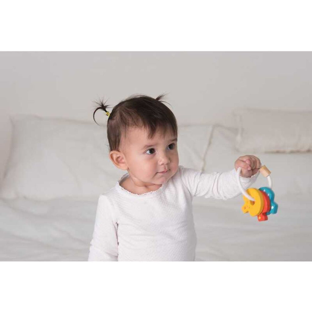 Kid playing PlanToys Baby Key Rattle