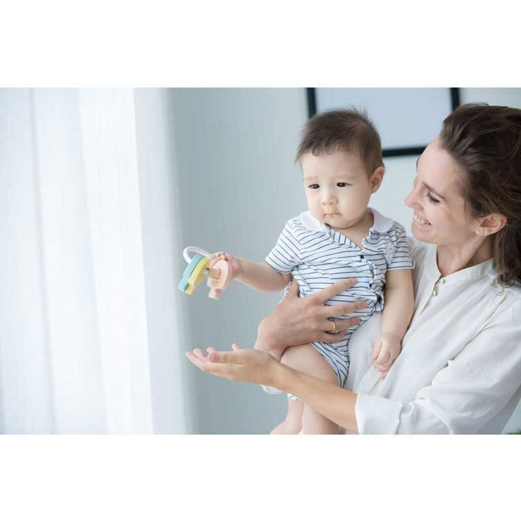 Kid playing PlanToys Key Rattle