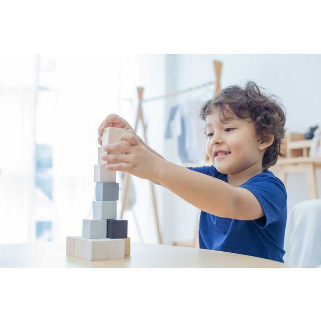 Kid playing PlanToys Cubes