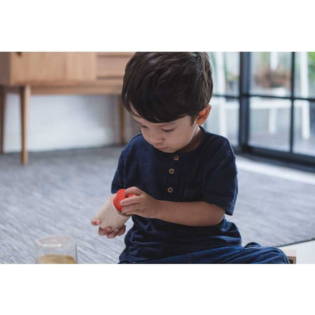 Kid playing PlanToys Geo Matching Blocks