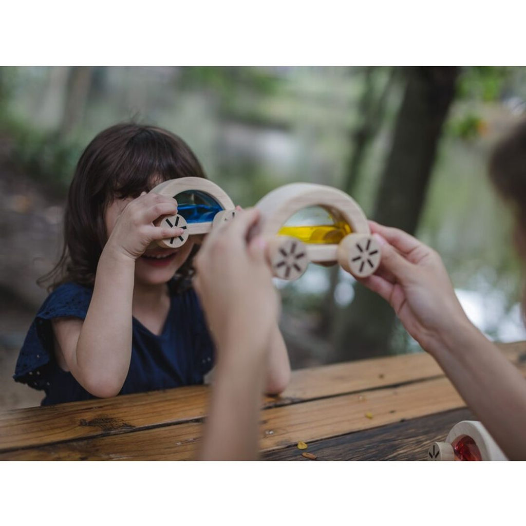 Kid playing PlanToys wautomobile