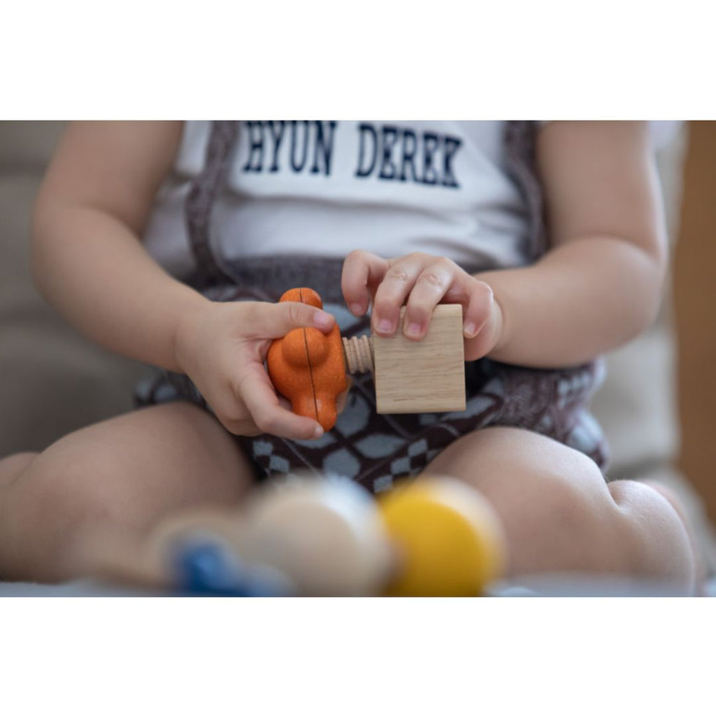 Kid playing PlanToys Nuts & Bolts