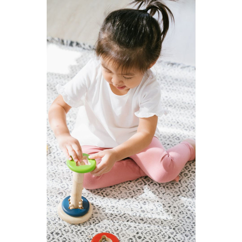 Kid playing PlanToys Twist & Sort