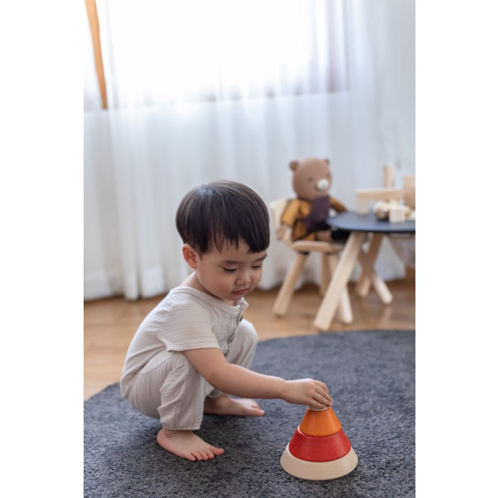 Kid playing PlanToys Cone Sorting - Unit Plus