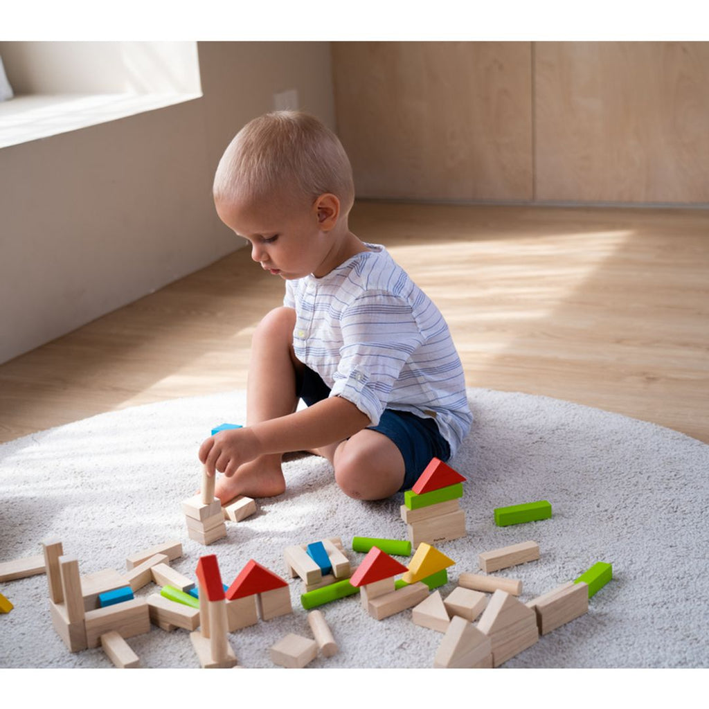 Kid playing PlanToys Colorful 40 Unit Blocks