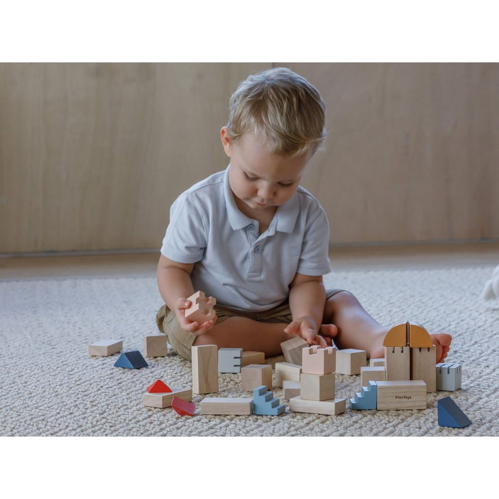 Kid playing PlanToys Creative Blocks - Orchard Series