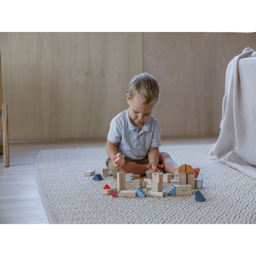 Kid playing PlanToys Creative Blocks - Orchard Series