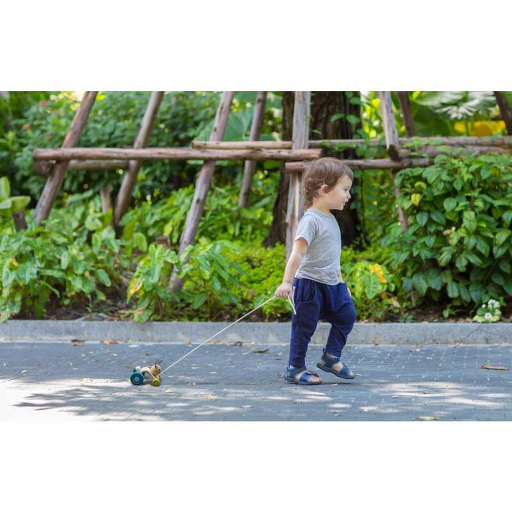 Kid playing PlanToys Hopping Rabbit