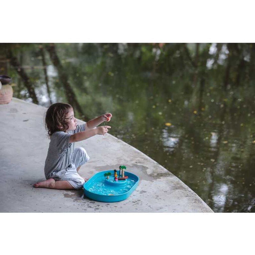 Kid playing PlanToys Water Play Set