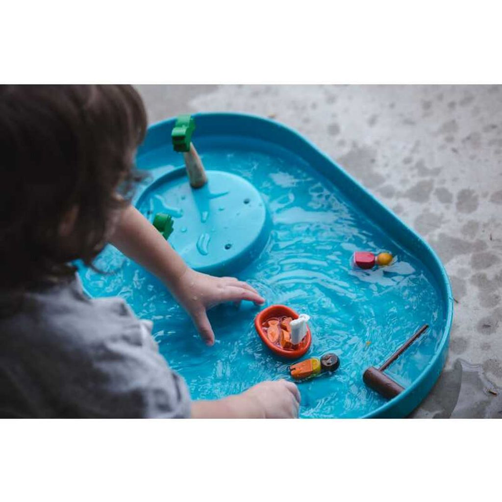 Kid playing PlanToys Water Play Set