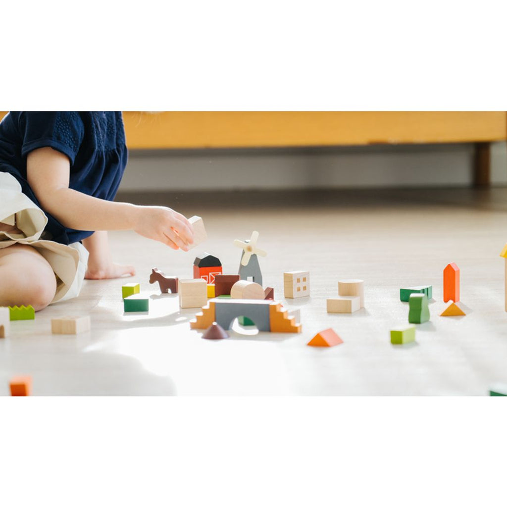 Kid playing PlanToys Countryside Blocks