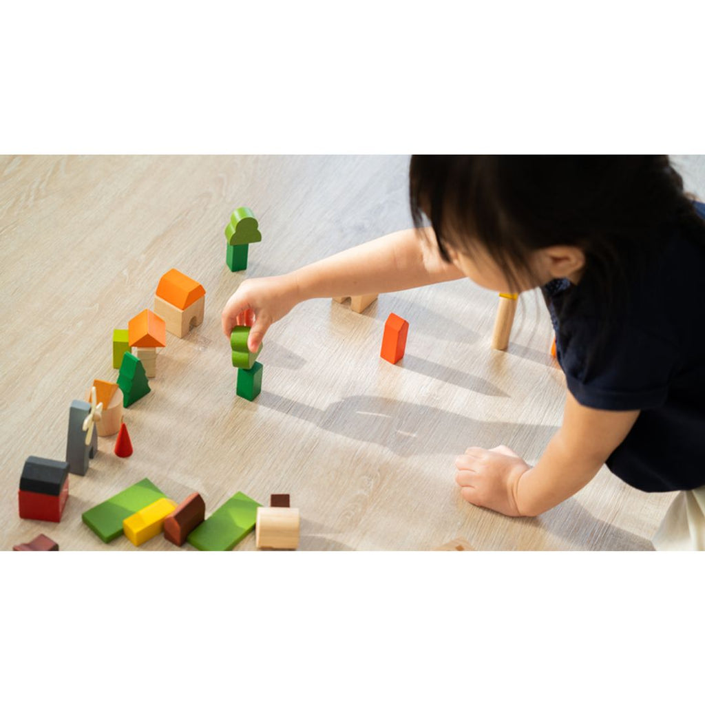 Kid playing PlanToys Countryside Blocks