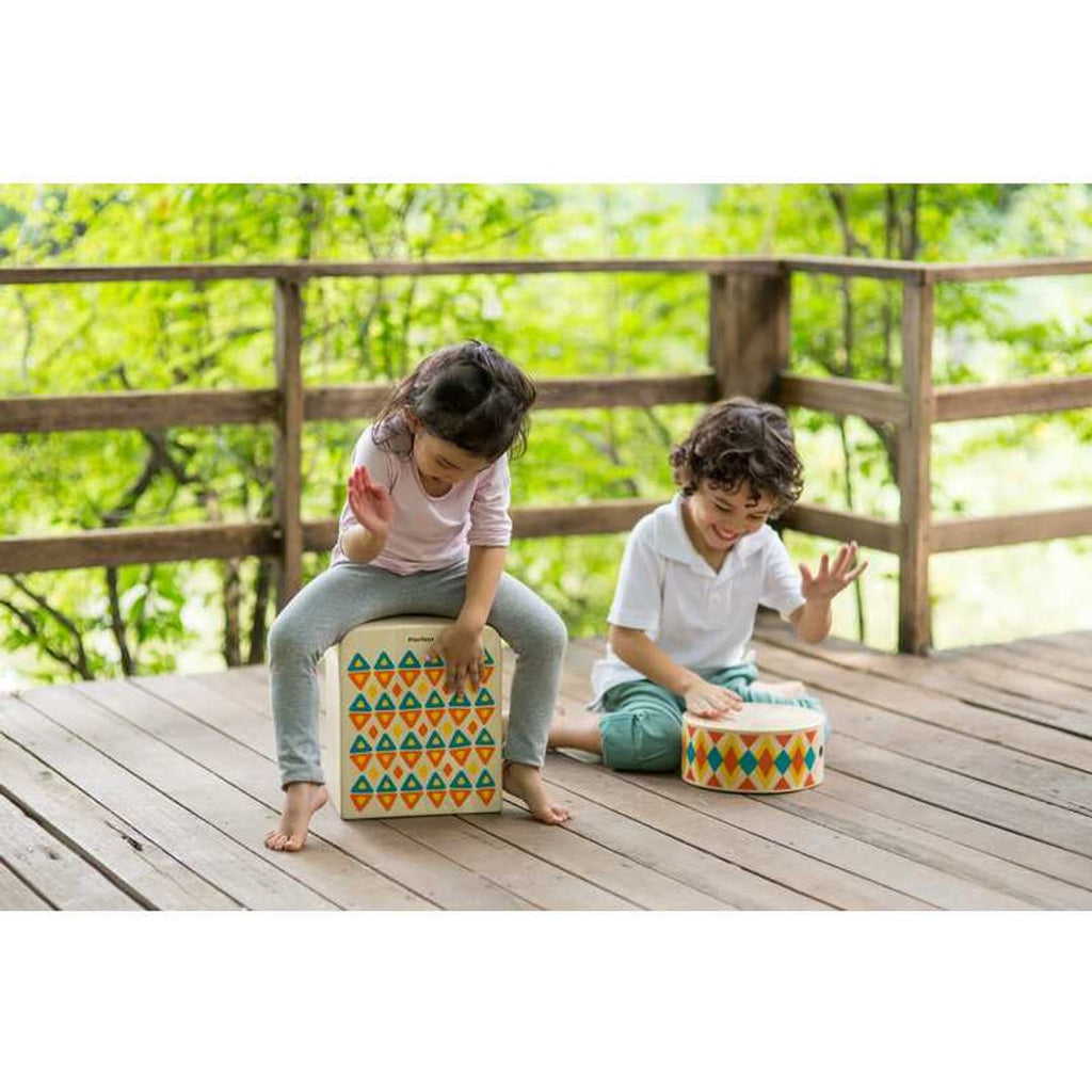 Kid playing PlanToys Rhythm Box