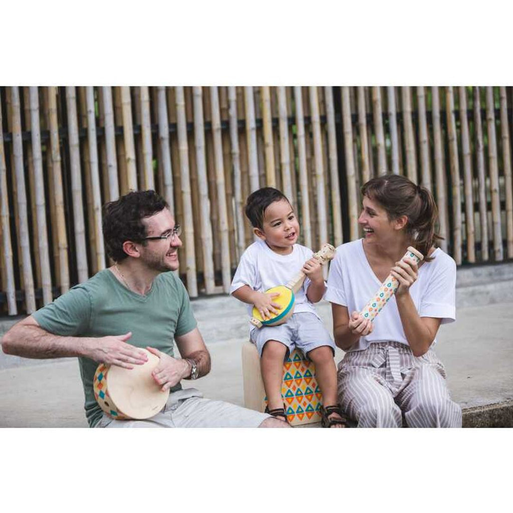 Kid playing PlanToys Banjolele