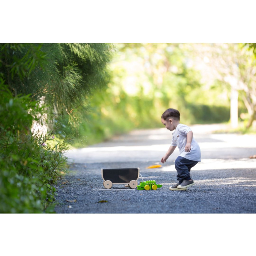 Kid using PlanToys Wagon - Black