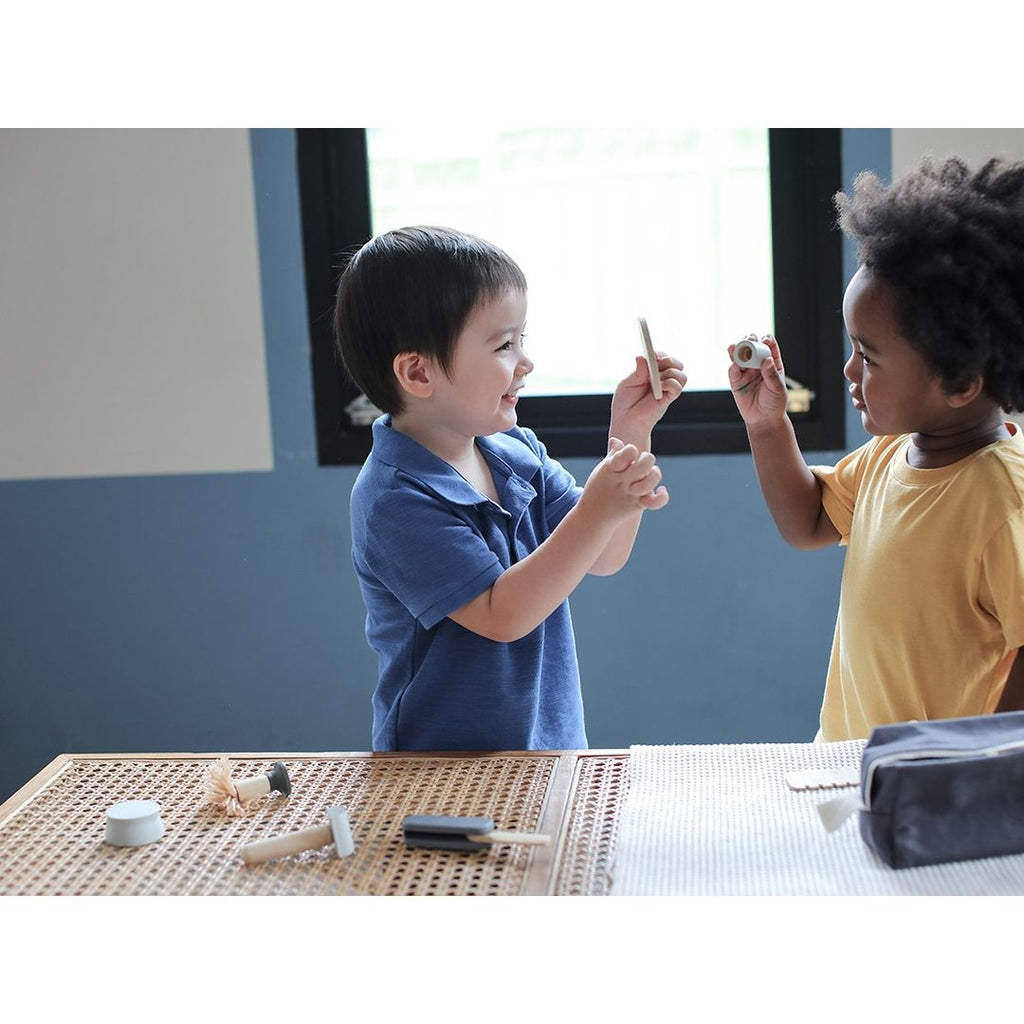 Kid playing PlanToys Shave Set