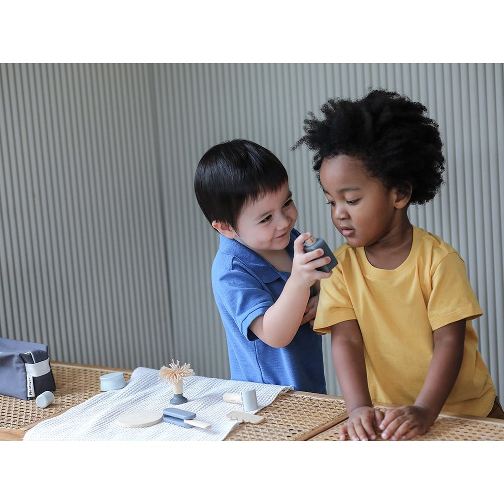 Kid playing PlanToys Shave Set