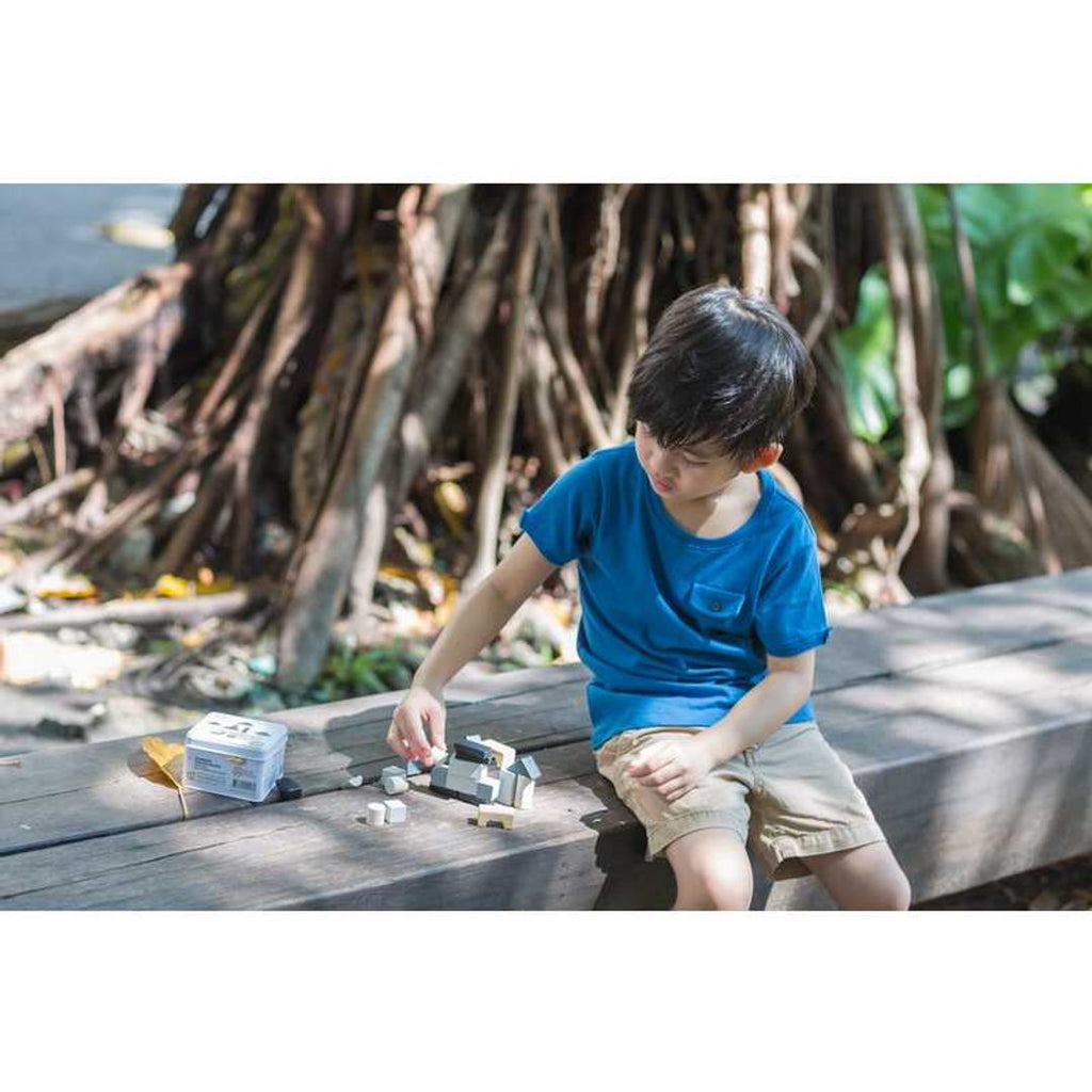 Kid playing PlanToys Construction Set