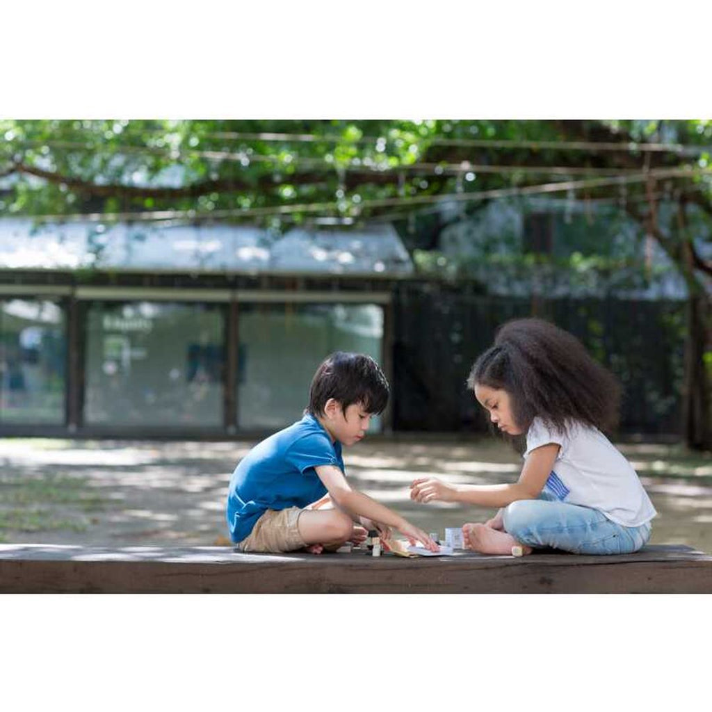 Kid playing PlanToys Construction Set