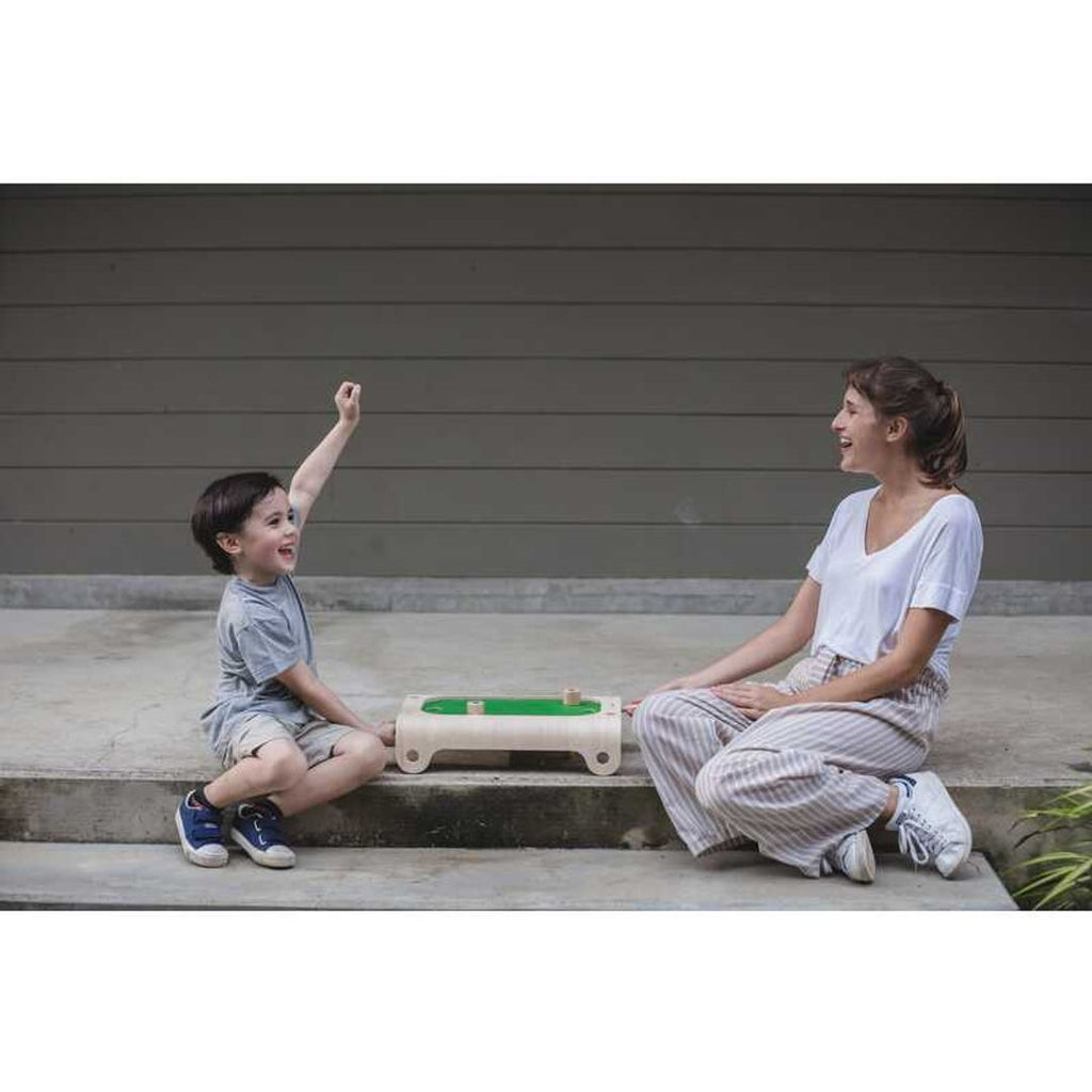 Kid playing PlanToys Magnetic Board Game