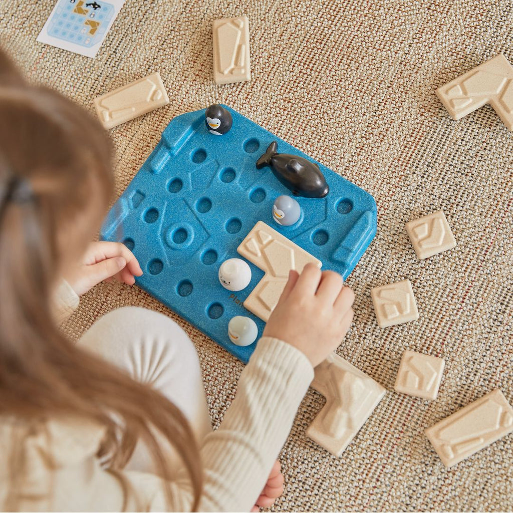 Kid playing PlanToys Finding Penguin Game