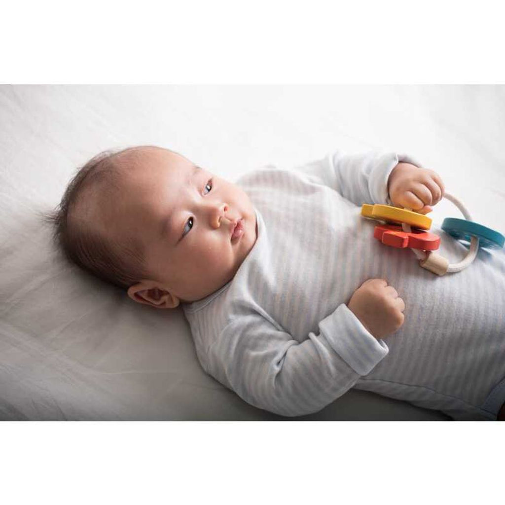 Kid playing PlanToys Baby Key Rattle