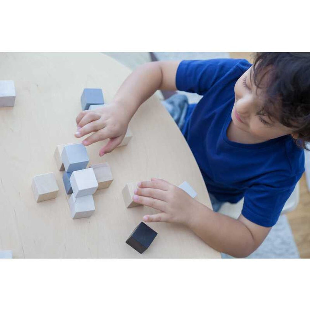 Kid playing PlanToys Cubes