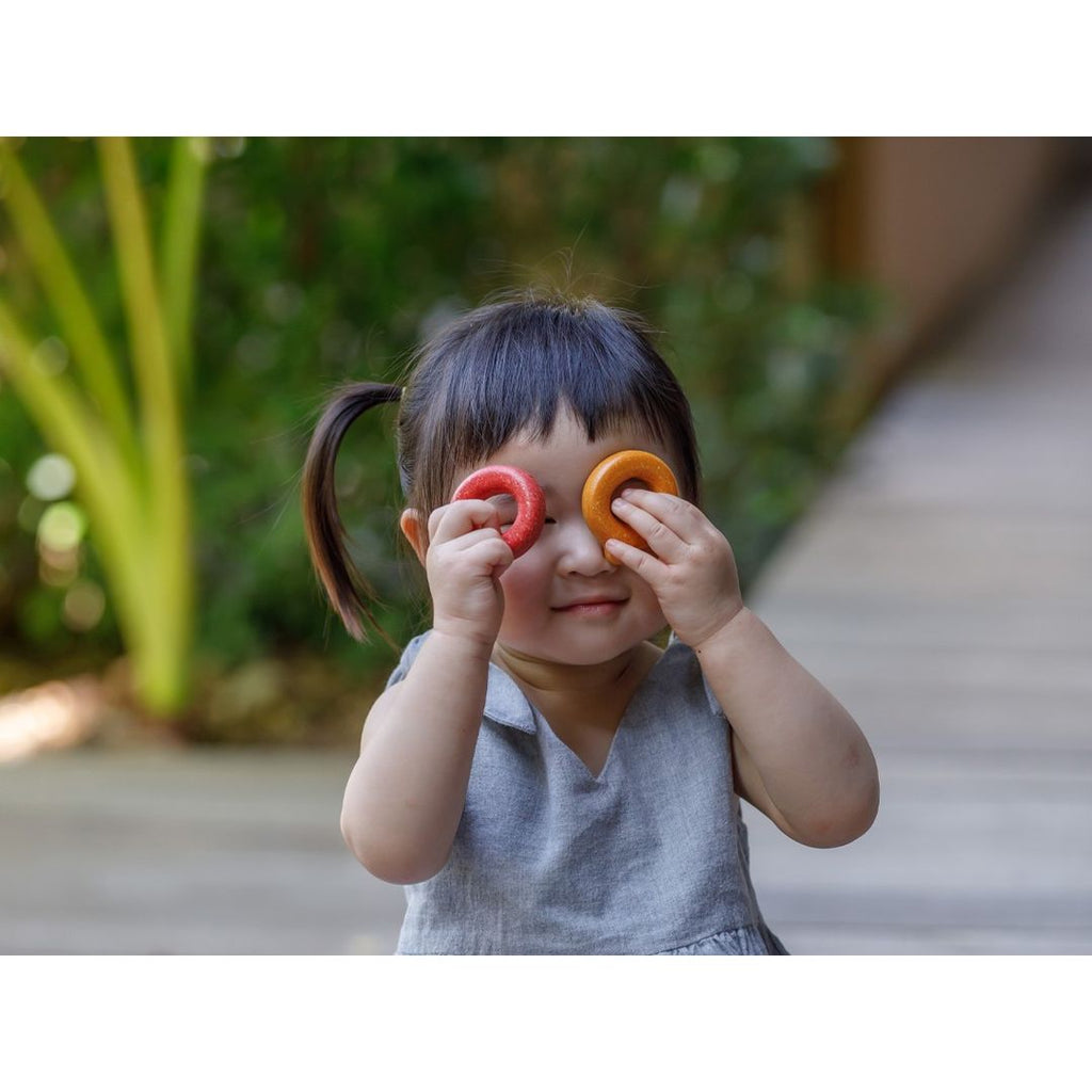 Kid playing PlanToys Upper Case Alphabet