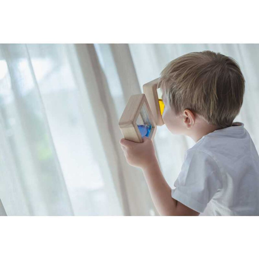 Kid playing PlanToys Water Blocks