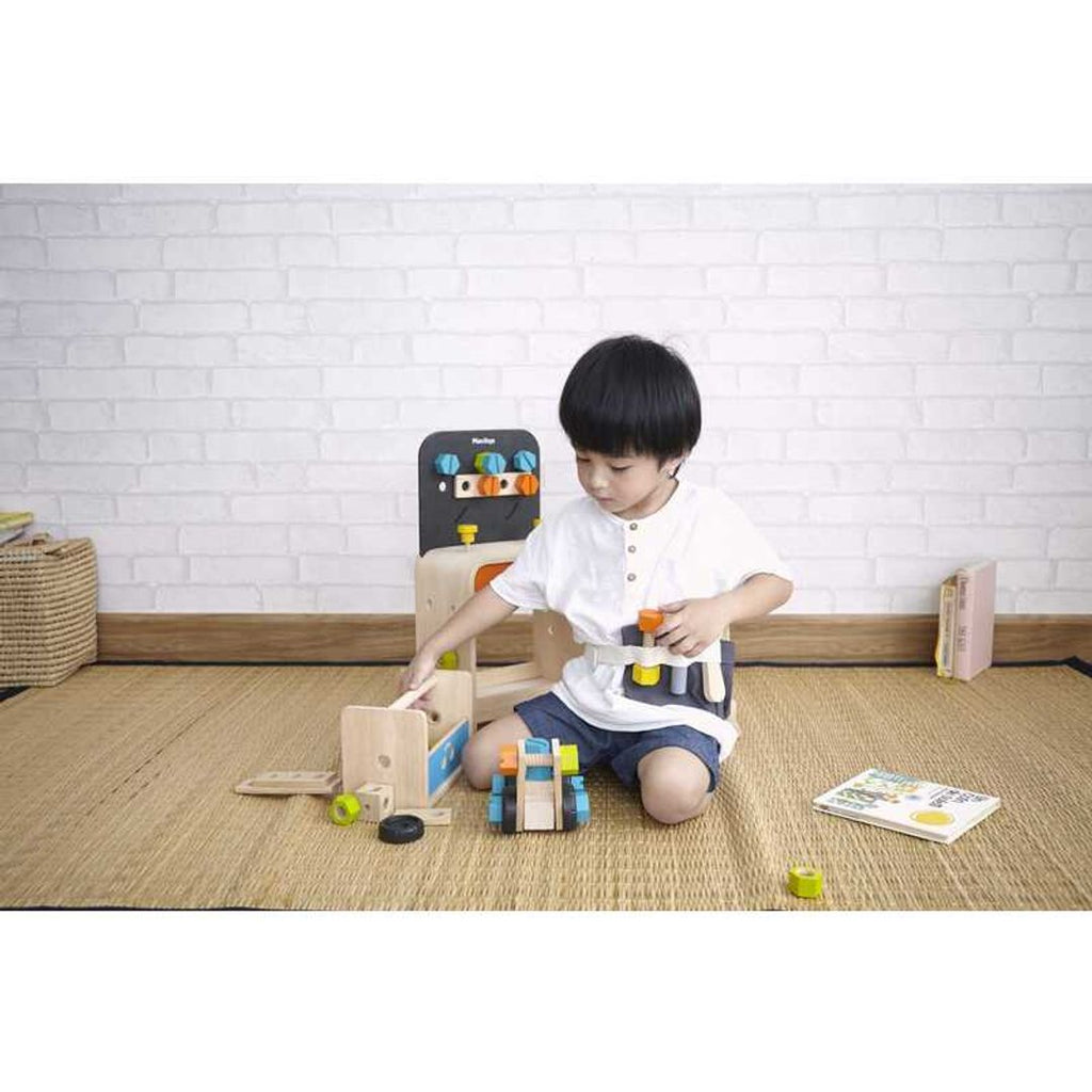 Kid playing PlanToys Construction Set