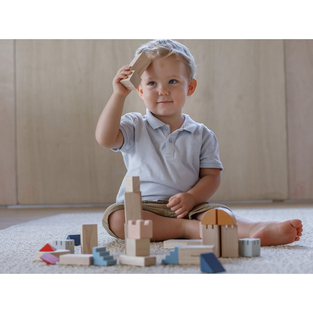 Kid playing PlanToys Creative Blocks - Orchard Series