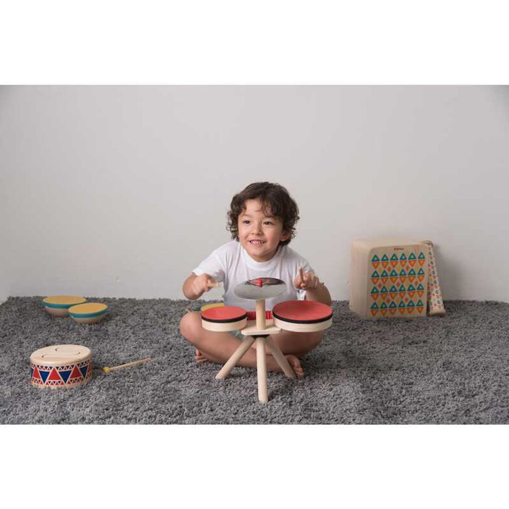 Kid playing PlanToys Musical Band