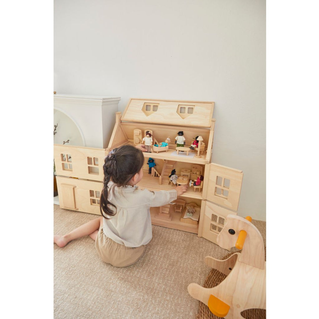 Kid playing PlanToys Victorian Furniture Set