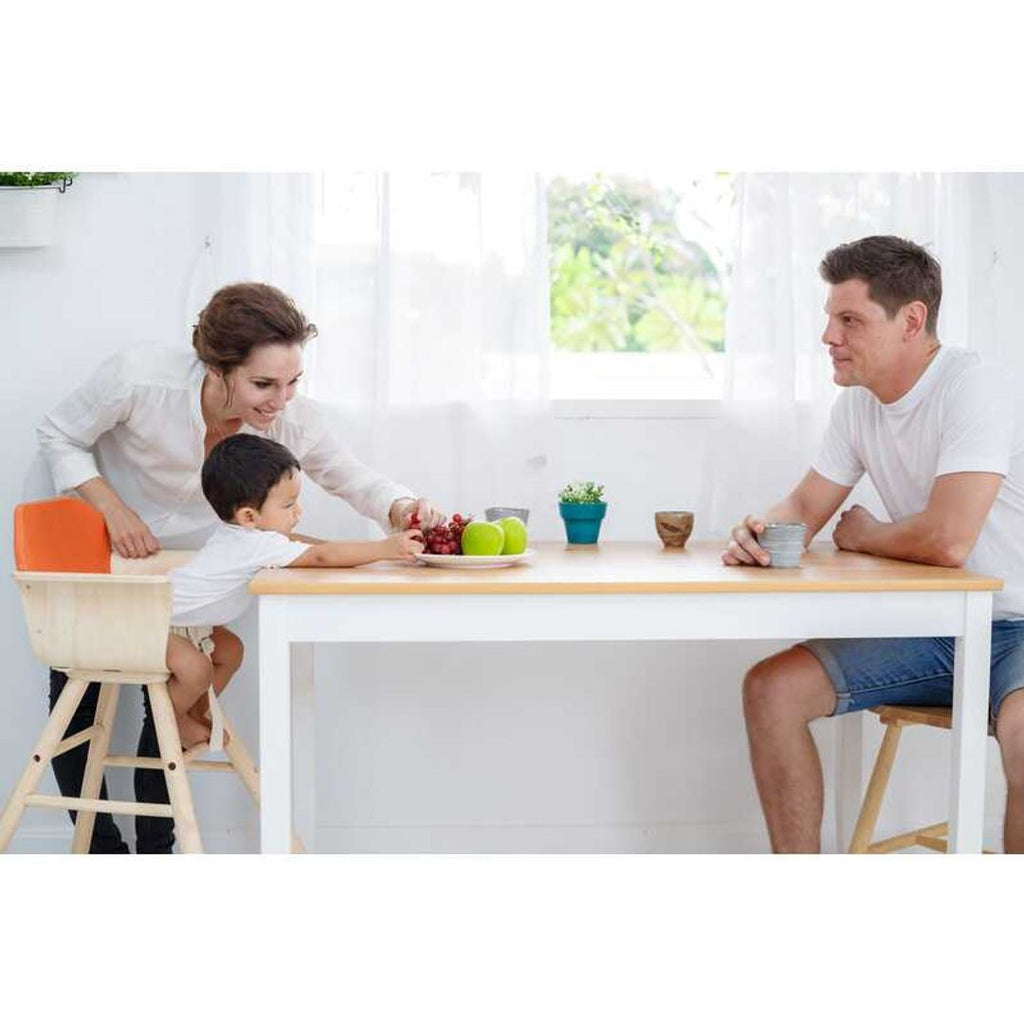 Kid using PlanToys High Chair - Orange